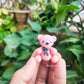 Miniature Teddy bear desk buddy, hyper-realistic collectible