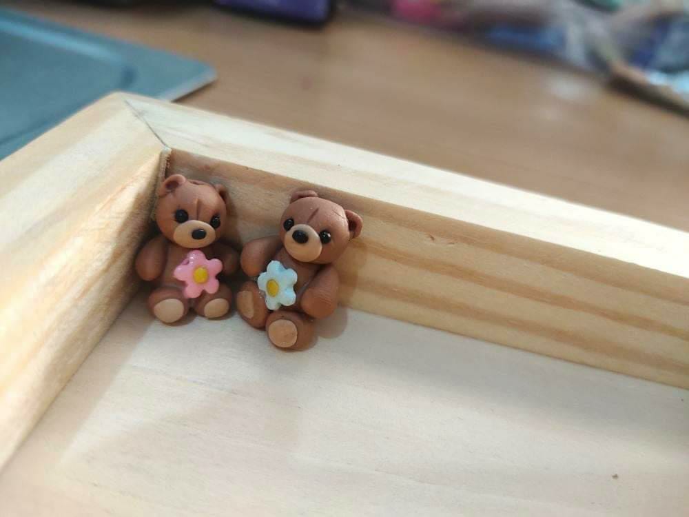 Miniature bears with flowers
